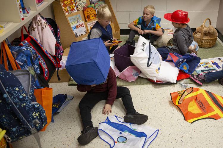 From left, kindergarteners Lane Schwarz, Jobi Hewston, Harrison Olivier and Bryce Isenor play together during morning choice time at Dothan Brook School in White River Junction, Vt., on Tuesday, Oct. 8, 2024. Dothan Brook parents are raising money to replace mold-damaged classroom supplies as the cost of remediation and repair, not covered by the school’s insurance, reaches six figures. (Valley News - Alex Driehaus)